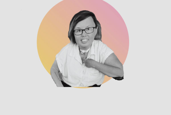 Picture of Stacey Park Milbern on a gray background.