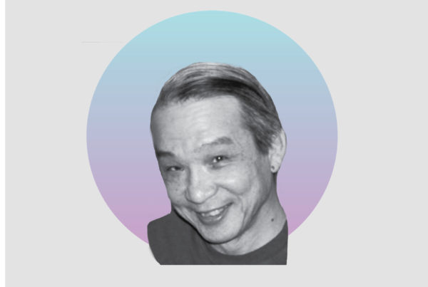 Picture of Tony Wong on a gray background.